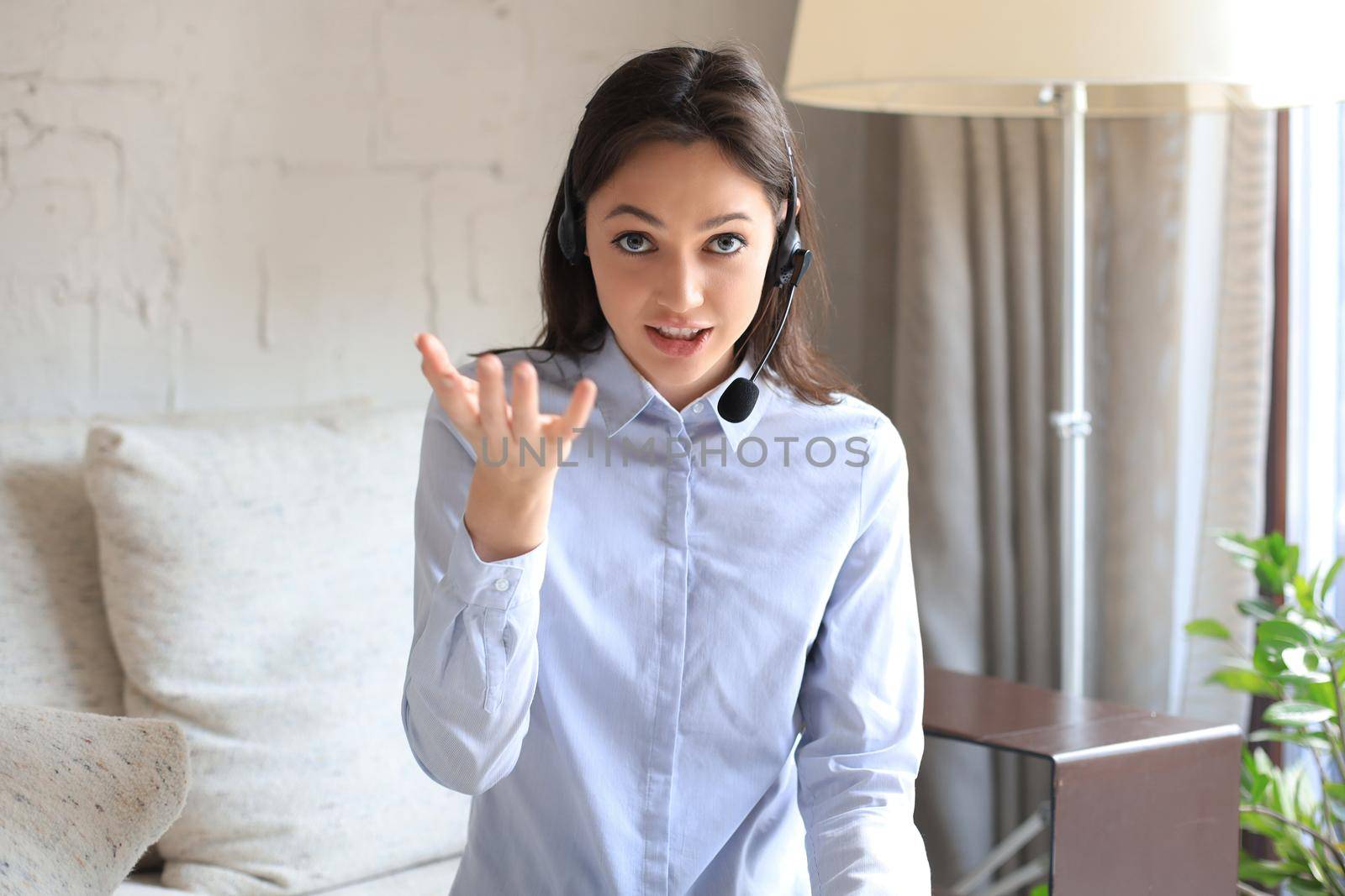 Freelance business women using tablet working call video conference with customer in workplace at home
