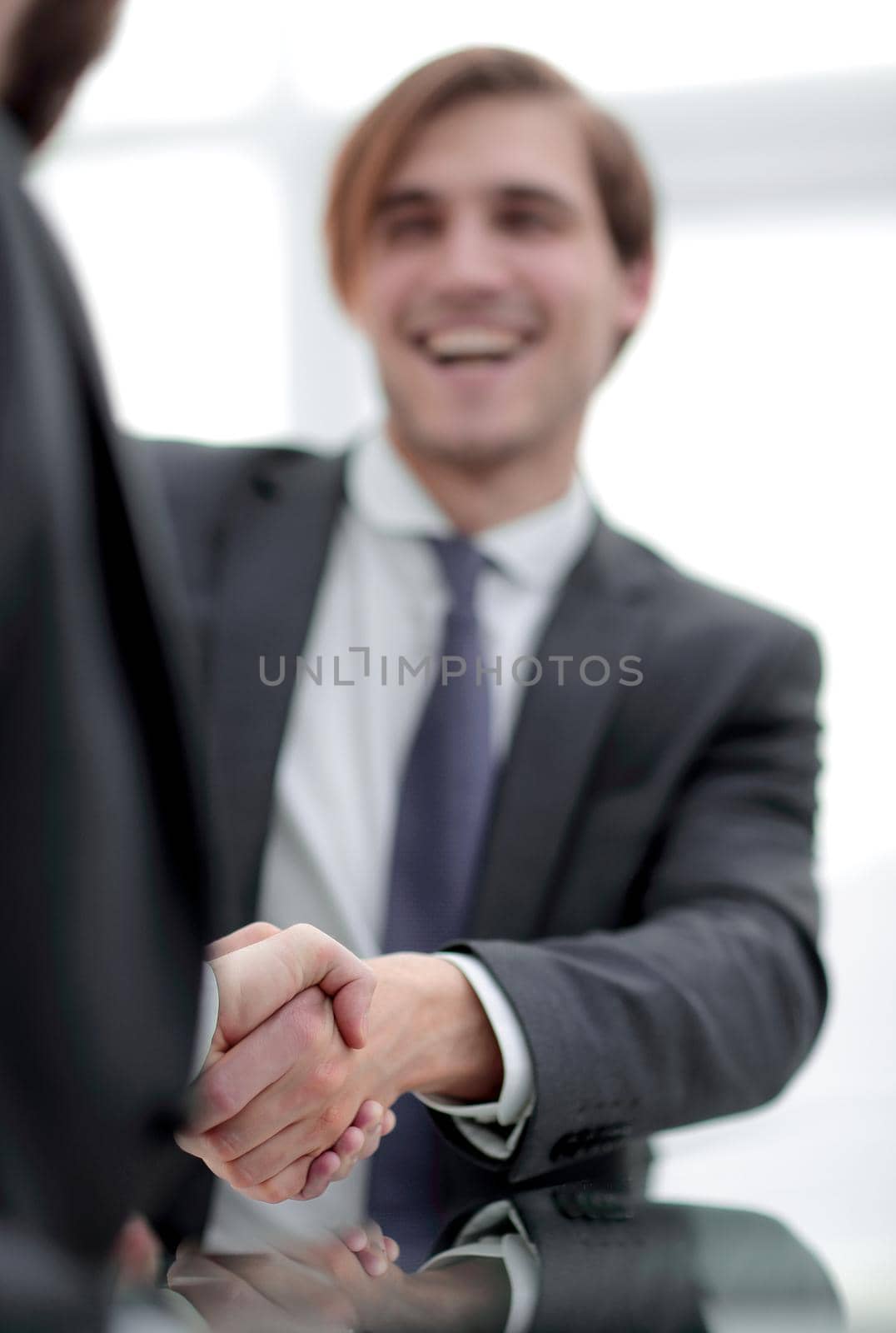 vertical photo.handshake business people . by asdf