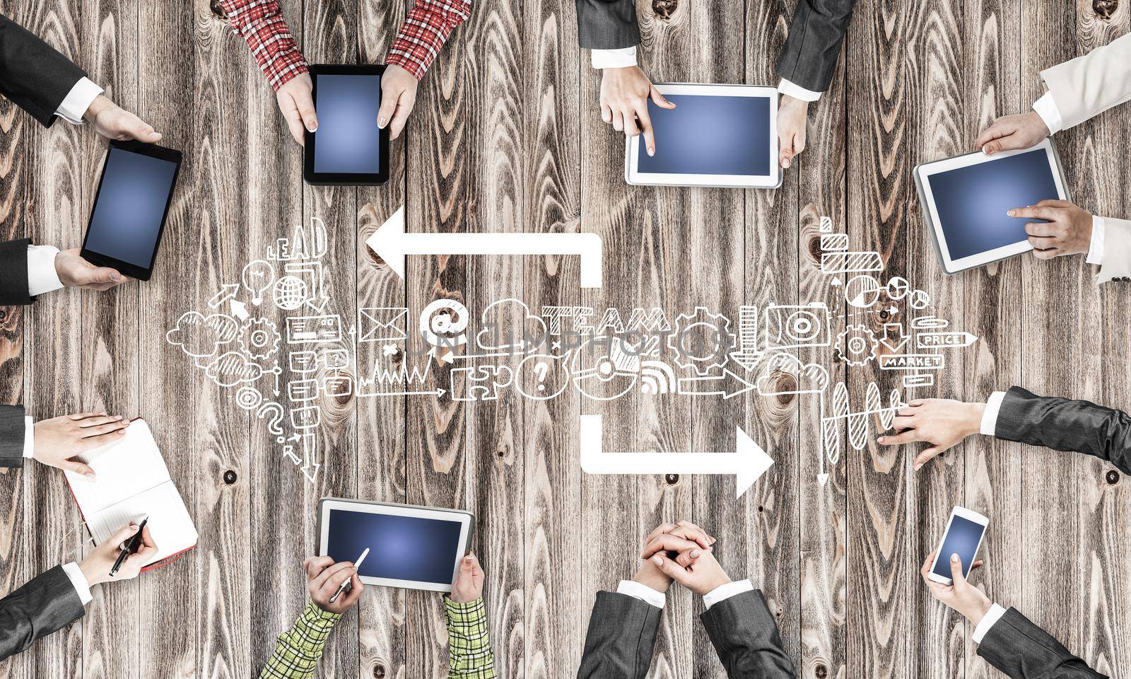 Group of people with devices in hands working together as symbol of networking and communication