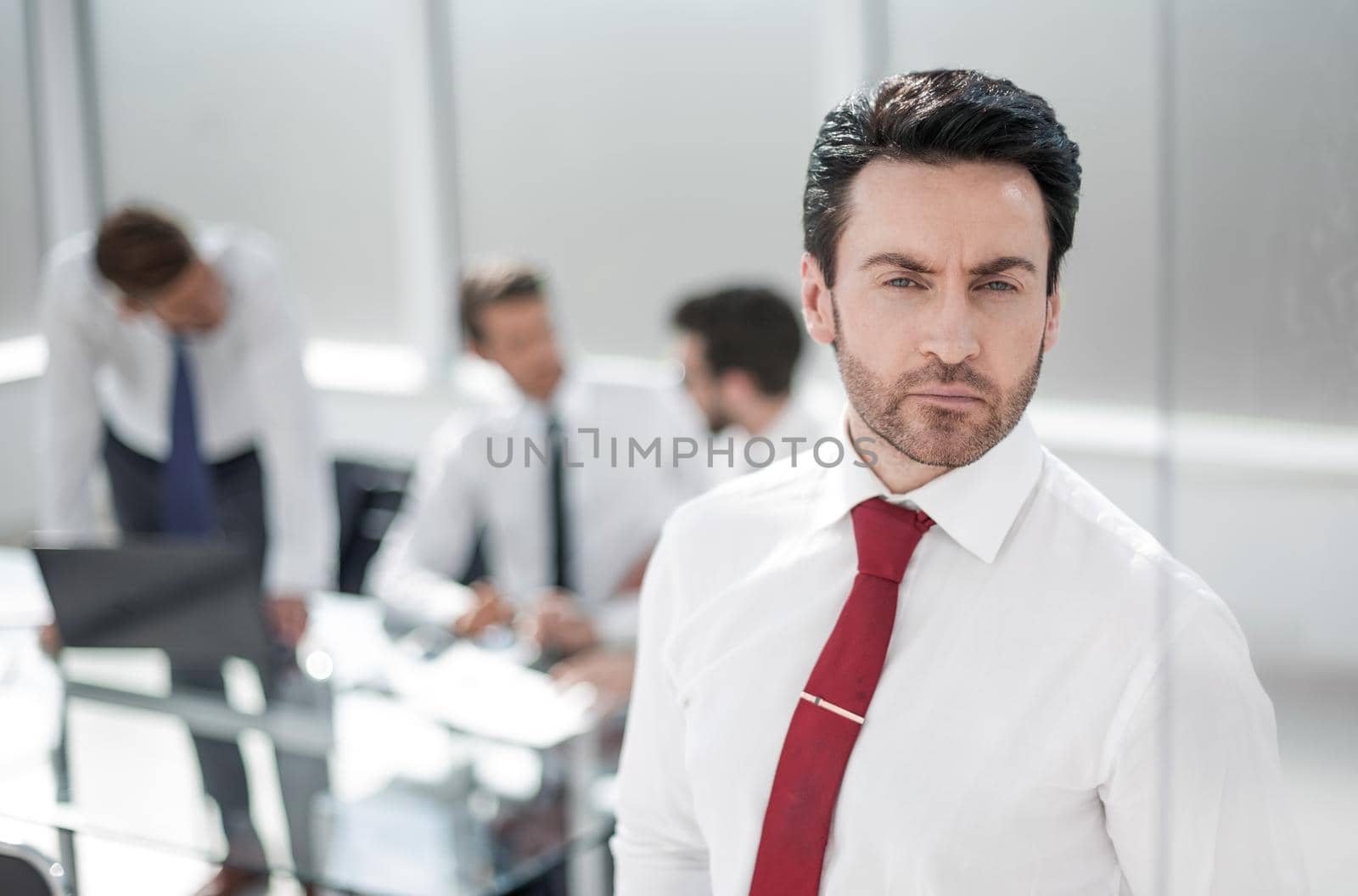 close up.serious businessman standing in the office.photo with copy space