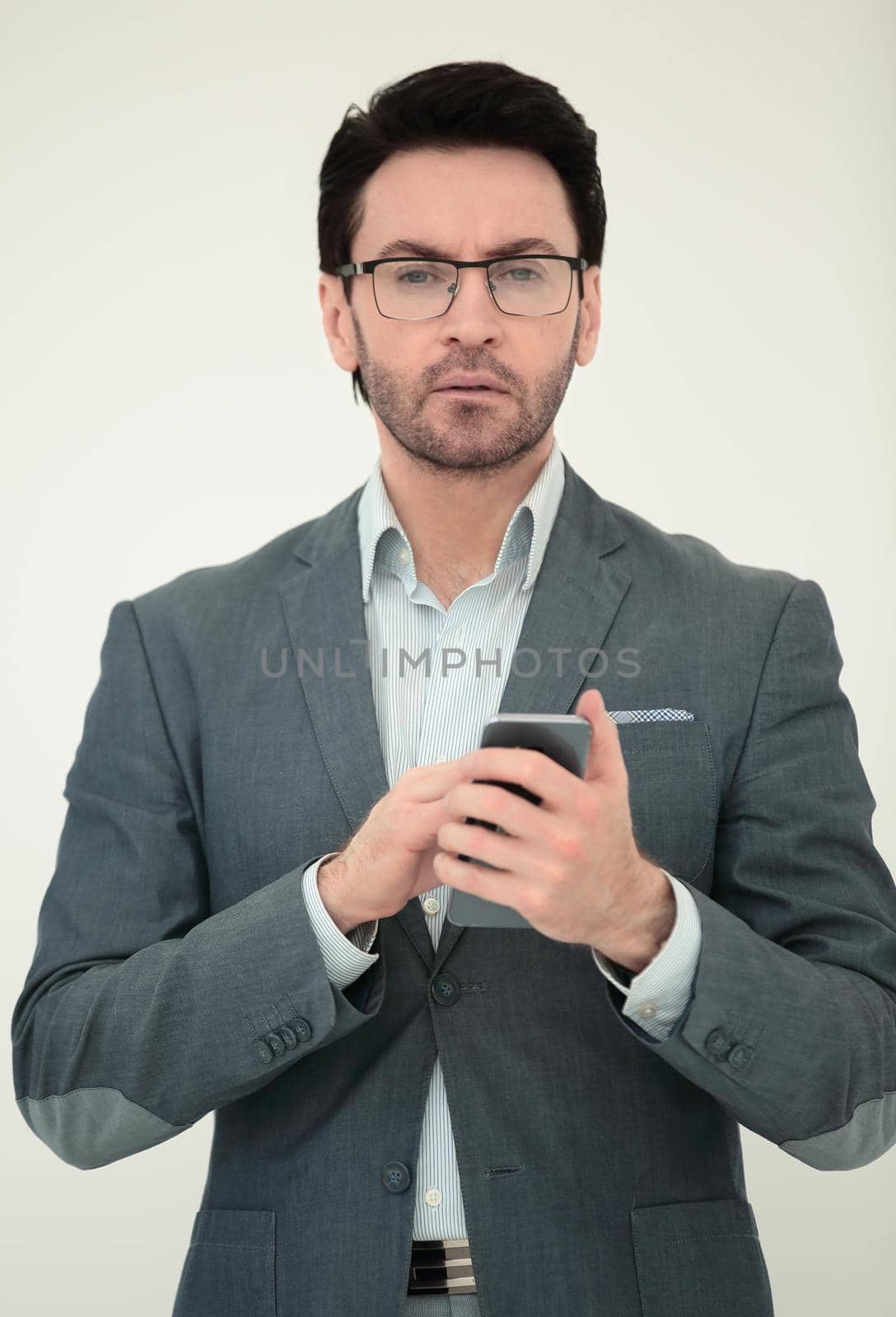 close up. business man reading an SMS on his smartphone.people and technology