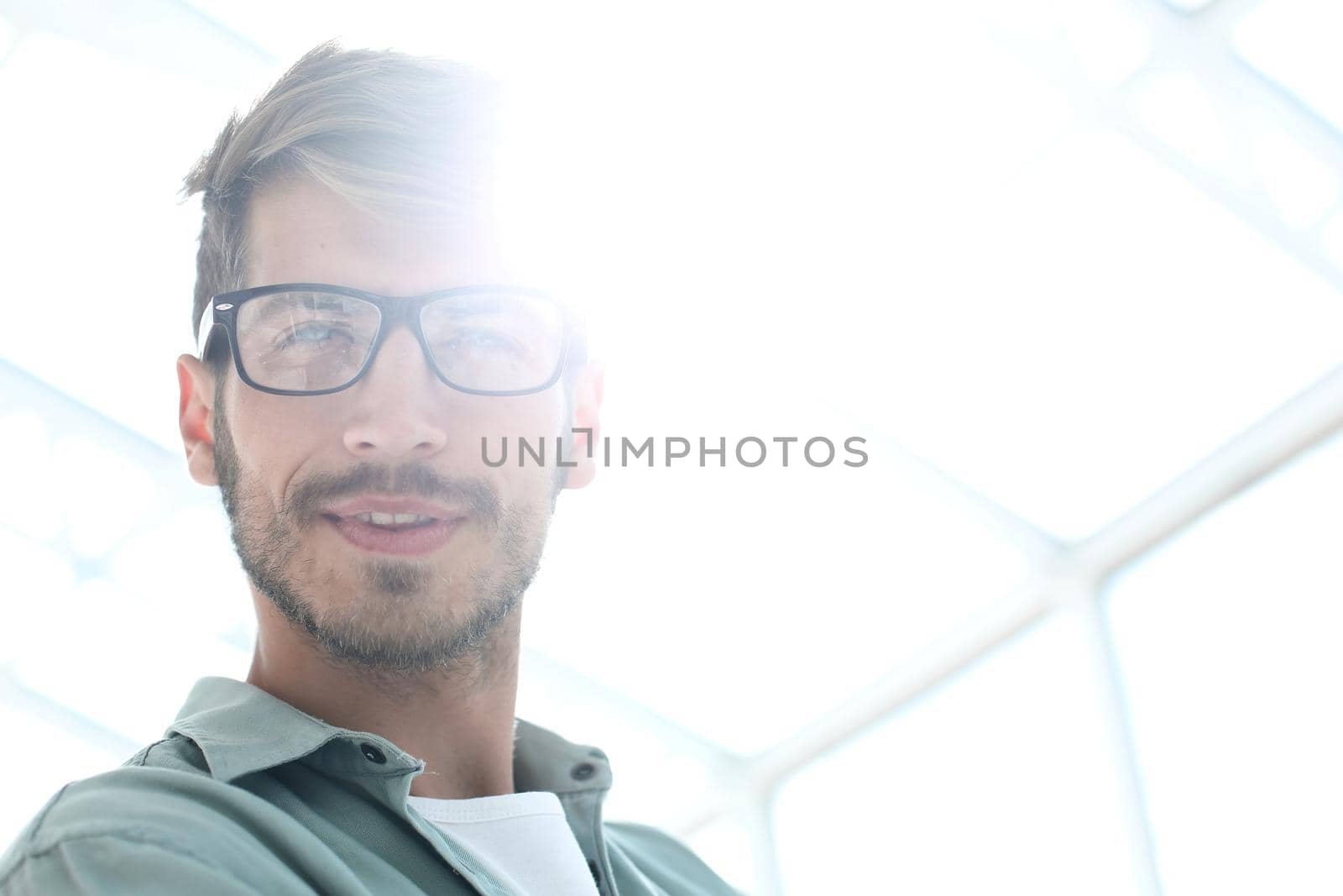 Elegant man in glasses. Optics style for men. Handsome businessman in spectacles. Male beauty, fashion.