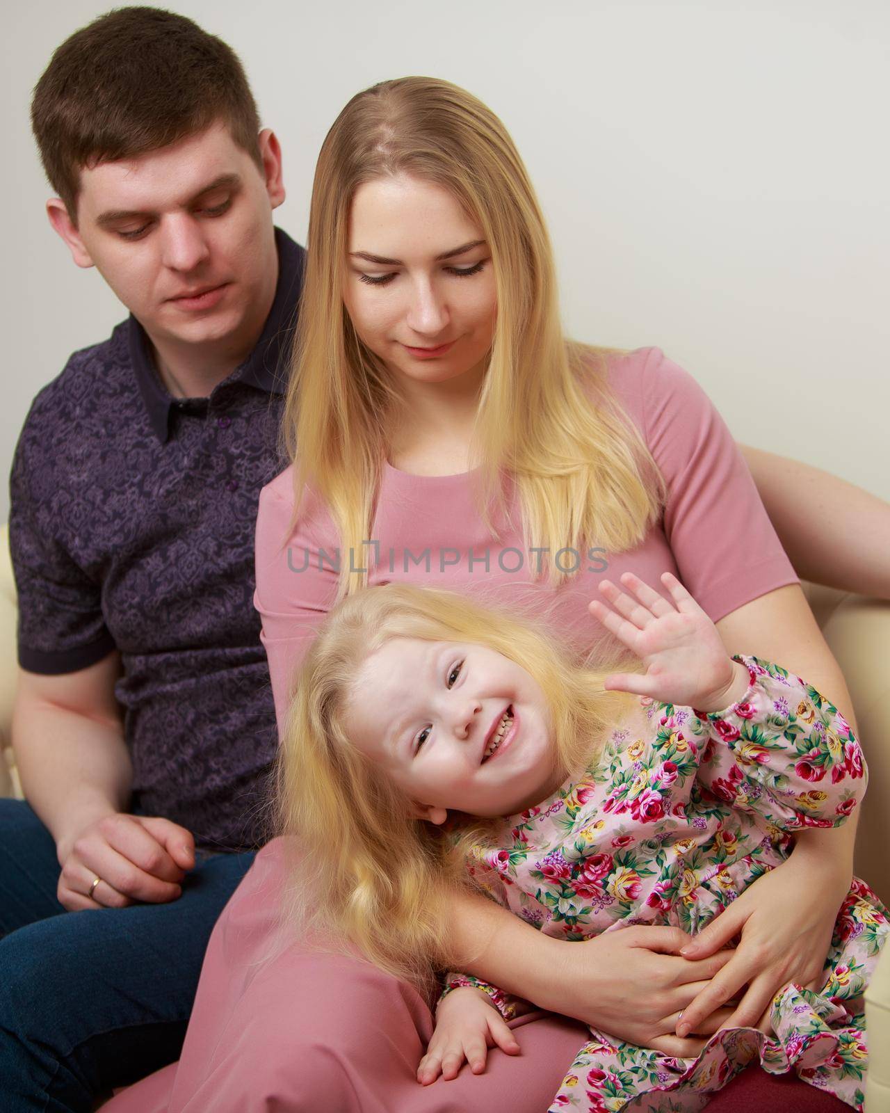 Happy family couple on a black background. Studio portrait.