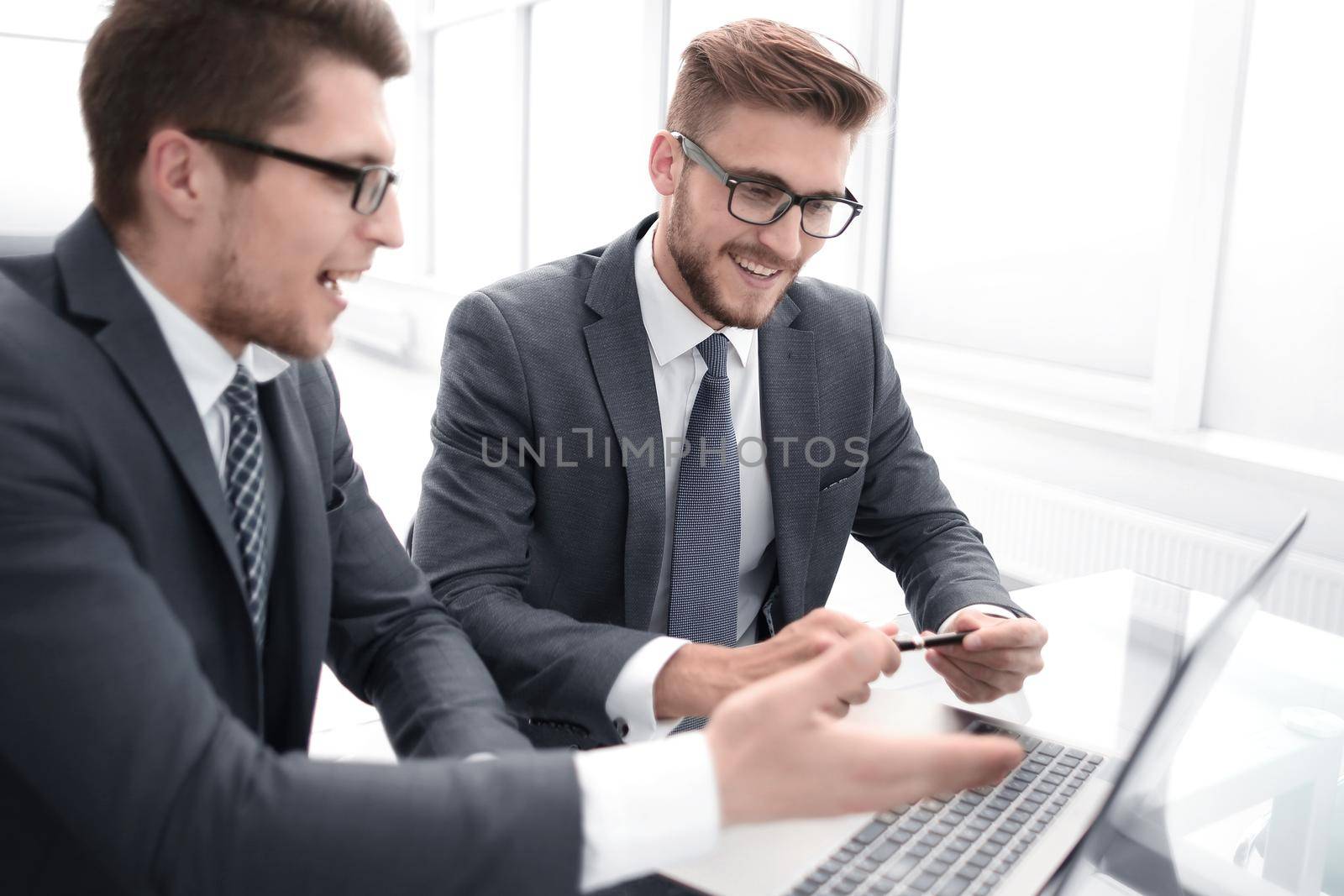 close up.two business people work on a laptop by asdf