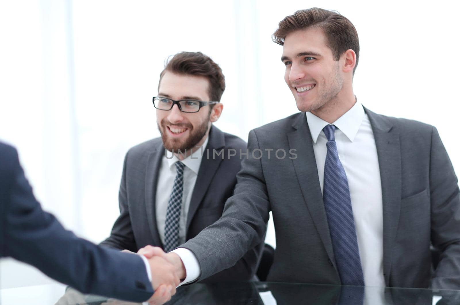 close up.businessman welcomes new business partner.