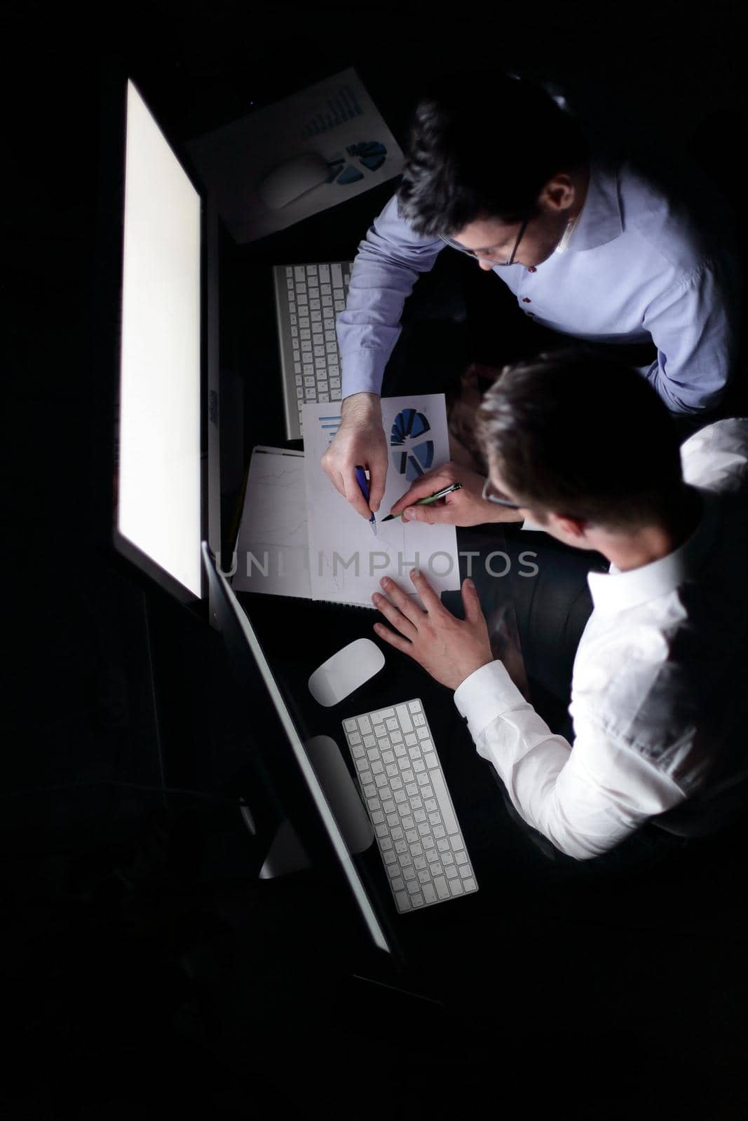 top view .employees checking financial data.the concept of overtime work