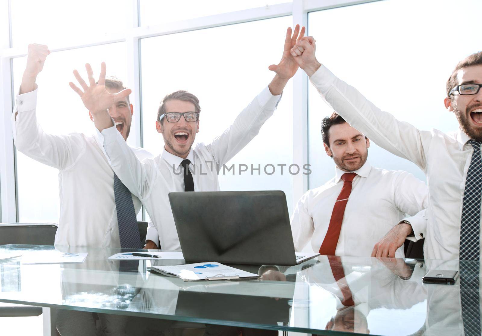 happy team showing their success.the concept of a successful startup