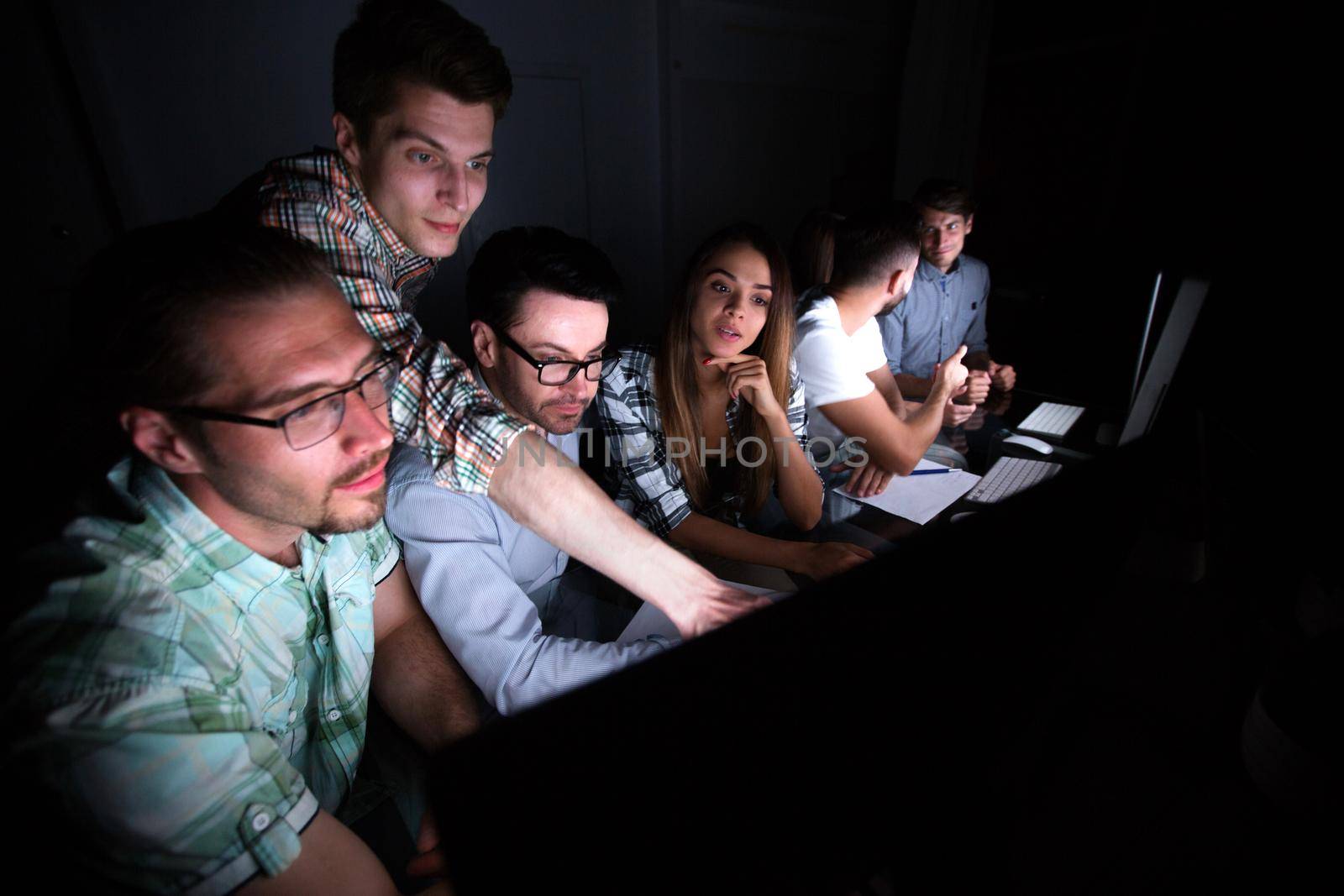 business team works in the office at night. business concept