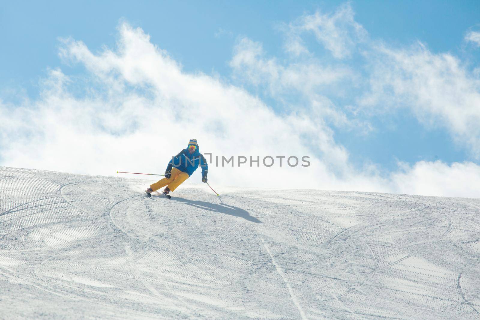 Alpine skier on slope at Cortina by destillat