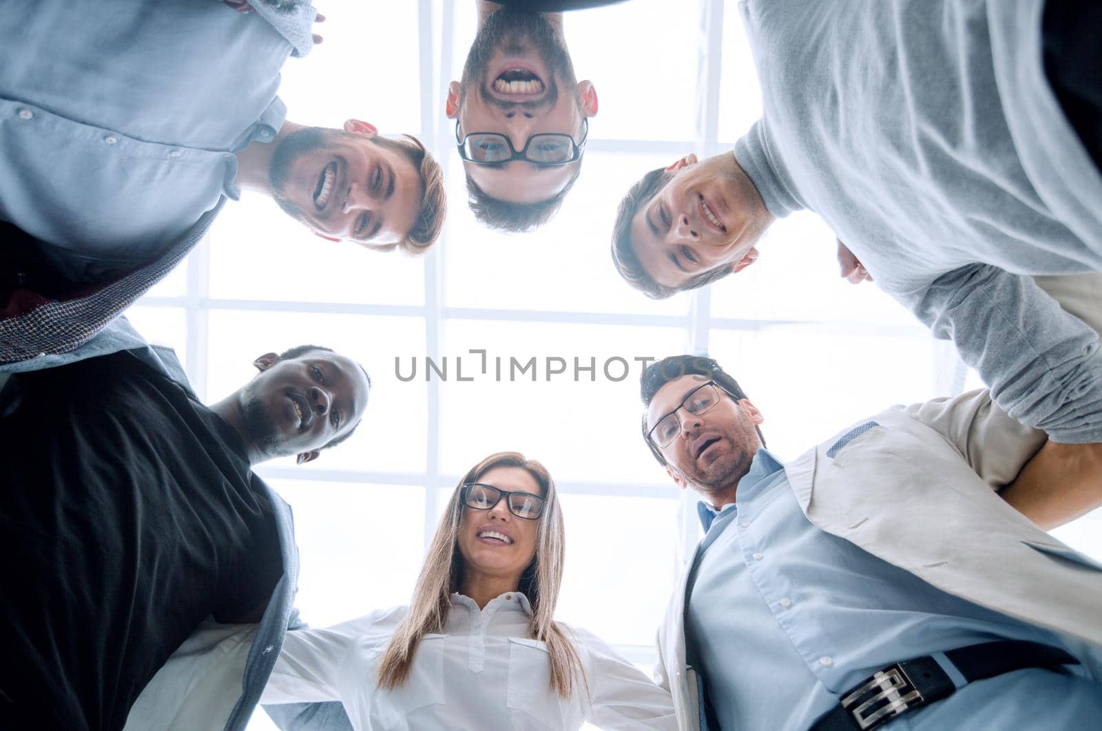bottom view.business team standing together.the concept of unity