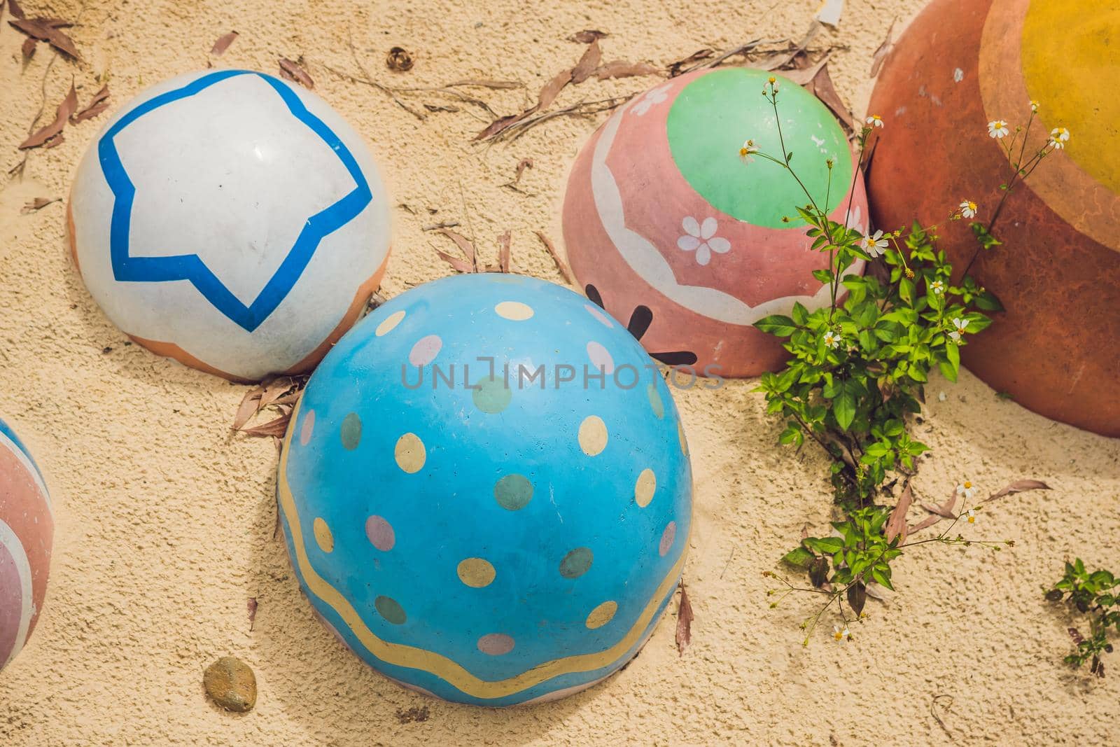 Multicolored eggs in the grass. Easter eggs hunt, outdoors. Celebrating Easter holiday by galitskaya