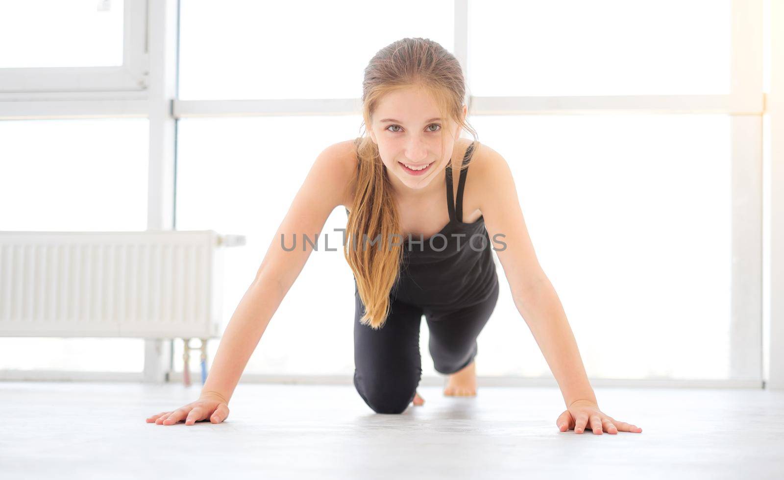 Pretty young girl doing exercises by GekaSkr