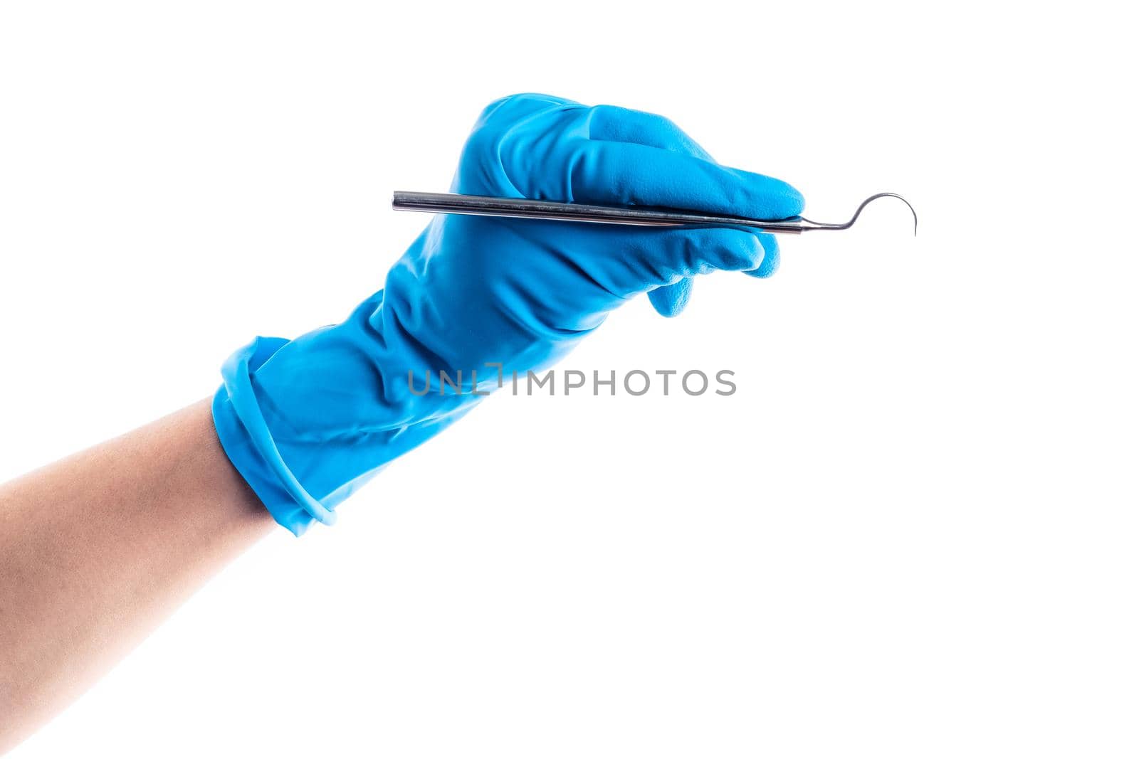 Hand in blue glove holding dental metal tool isolated on white background