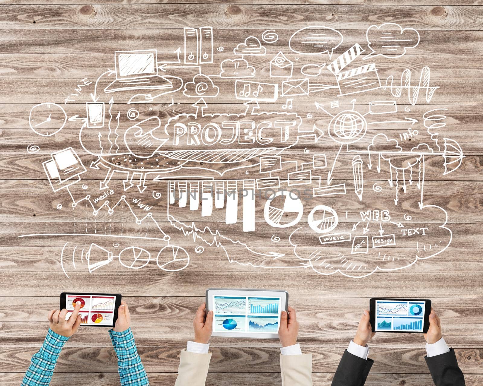 Group of three people with devices in hands working together as symbol of networking and communication