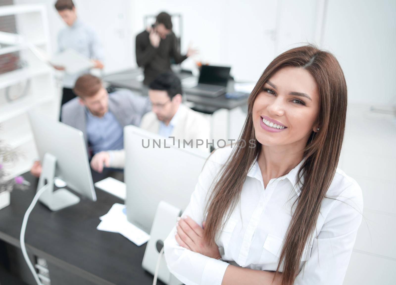 smiling businesswoman standing in a modern office.business people