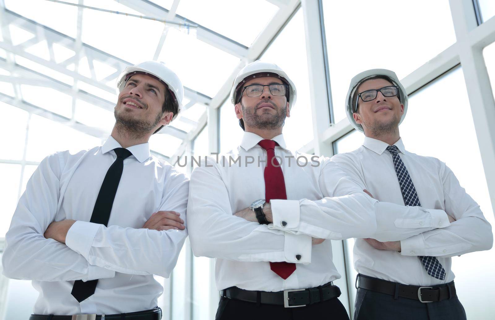 three architects standing in an empty office.business concept