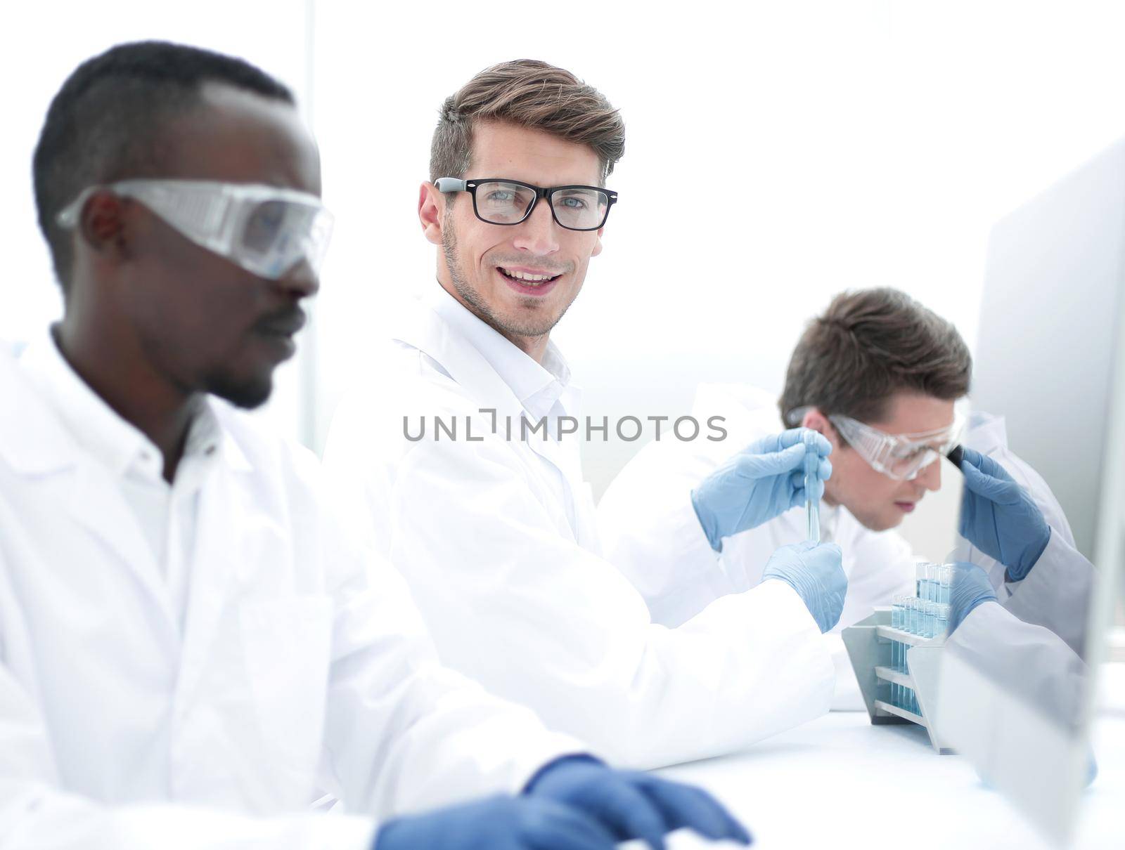 promising scientist working on a computer in the laboratory by asdf