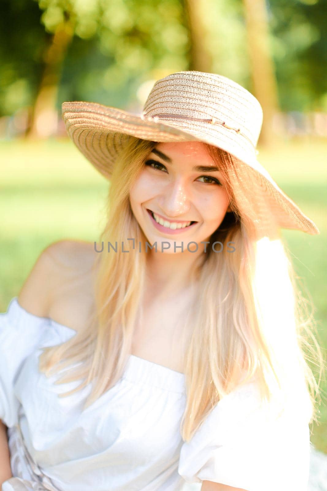 Portrait of young pretty caucasian girl in hat. Concept of beauty, female person and summer fashion.