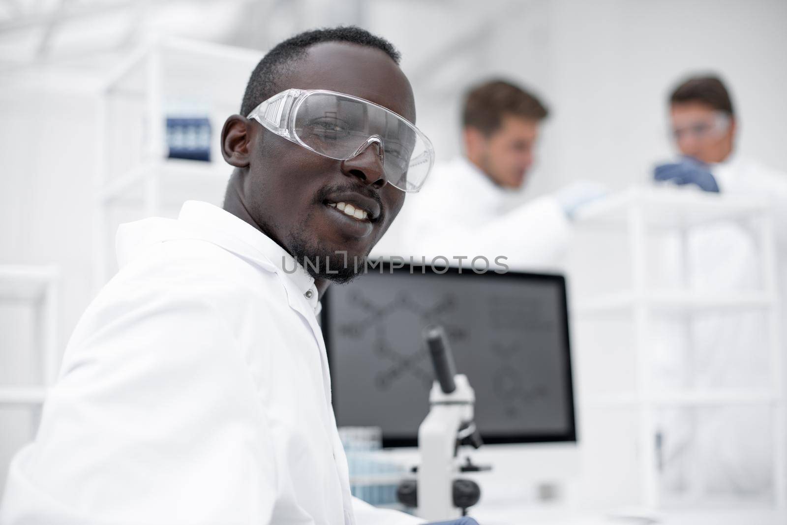 close up.modern scientist at the laboratory table by asdf