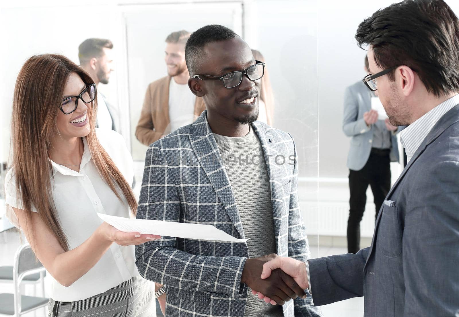 business partners discuss the document standing in the office.business concept