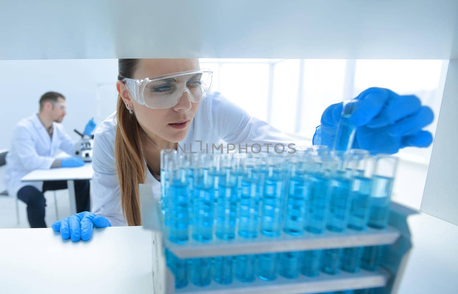 close up.scientist making tests of the liquid.photo with copy space
