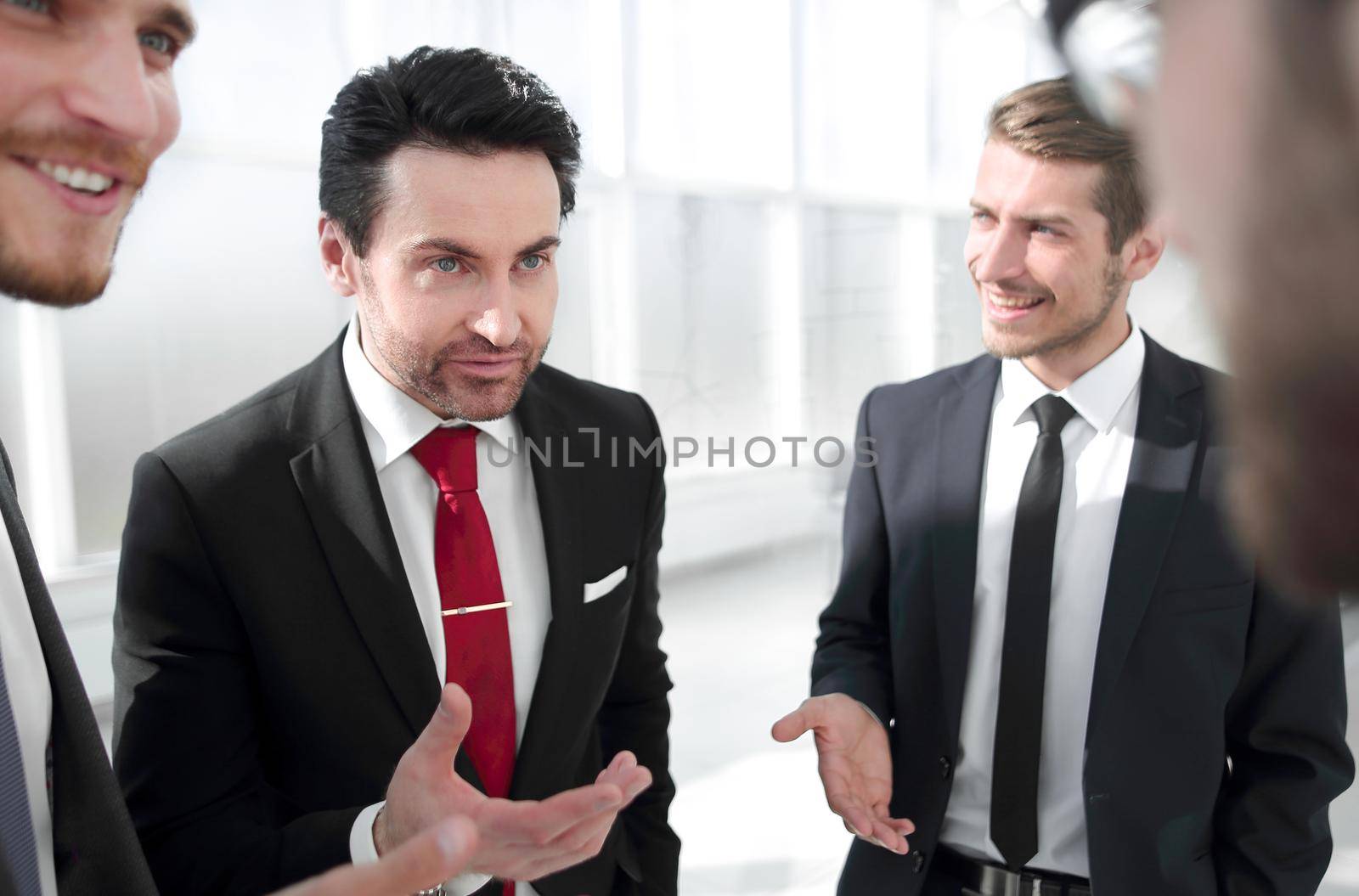 close up.Manager and employees of the company talking standing in the office