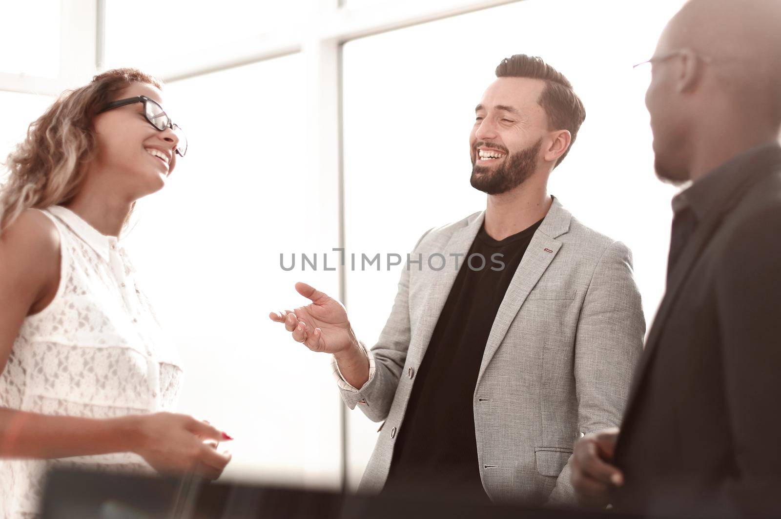 smiling business team on a work break.office weekdays