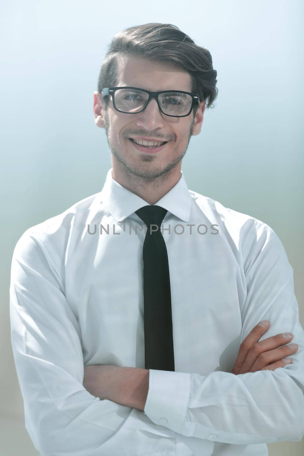 successful young businessman on a bright background.business people