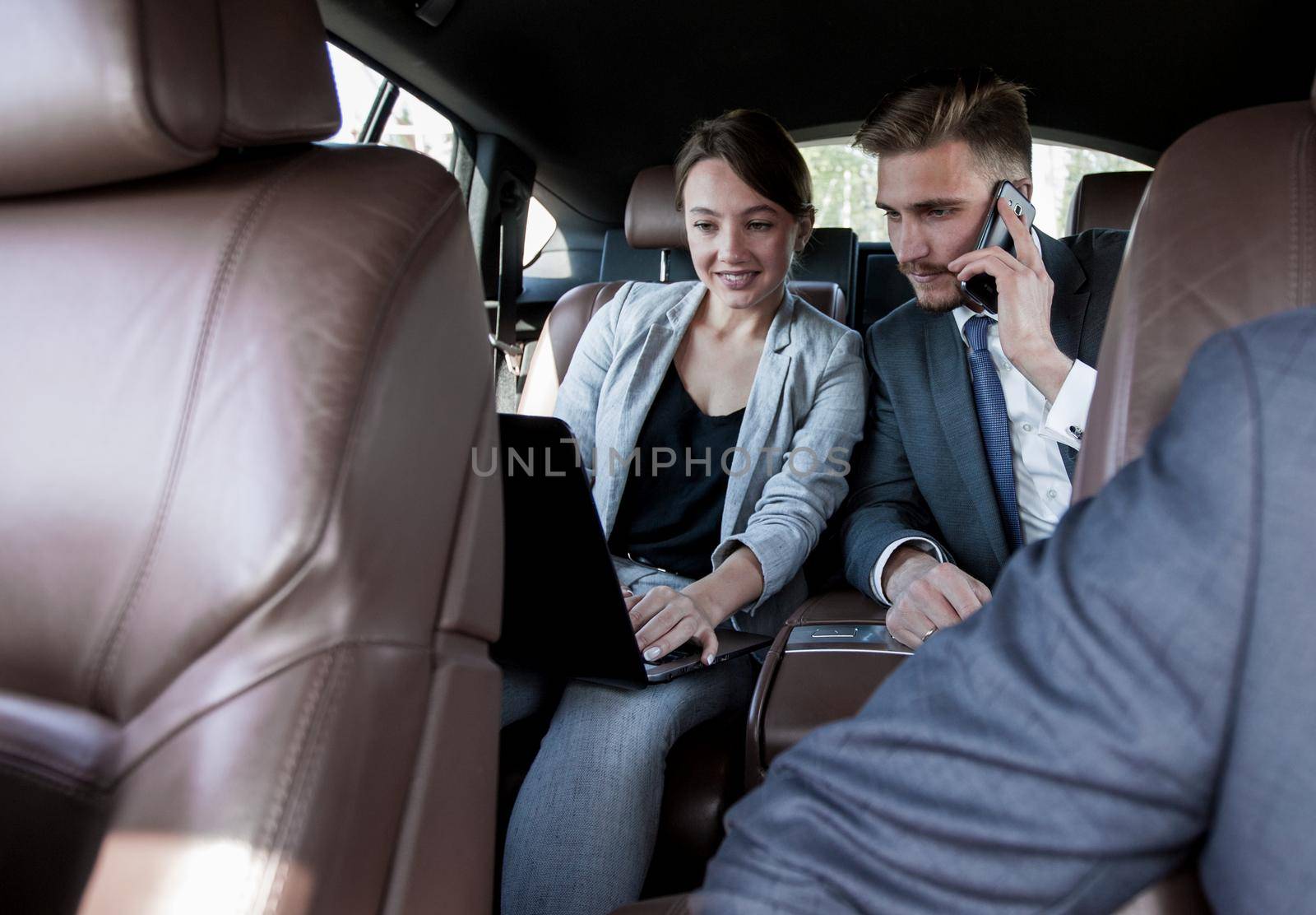 business colleagues working in the car.people and technology