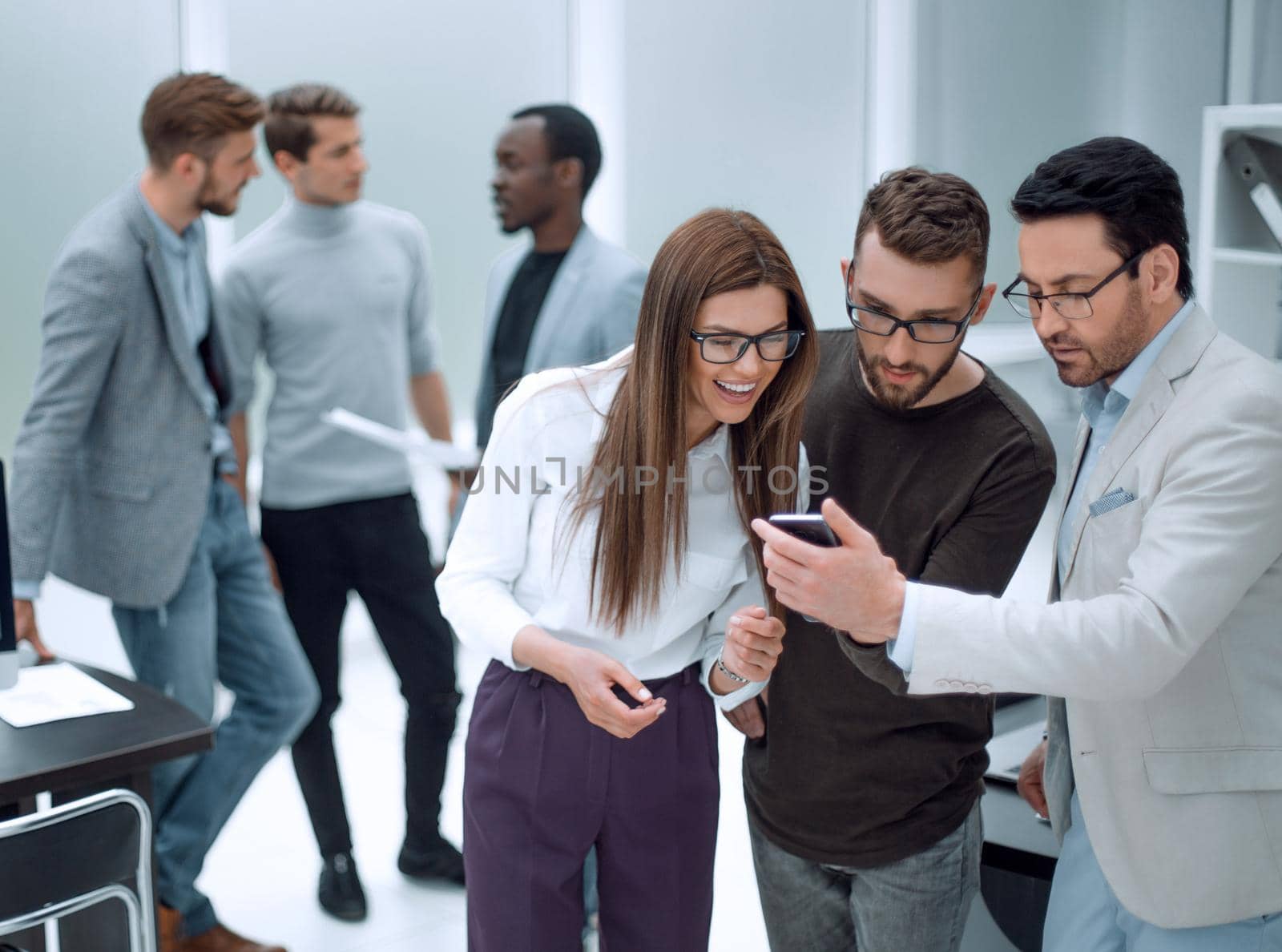 close up.group employee looking at the smartphone screen.office weekdays