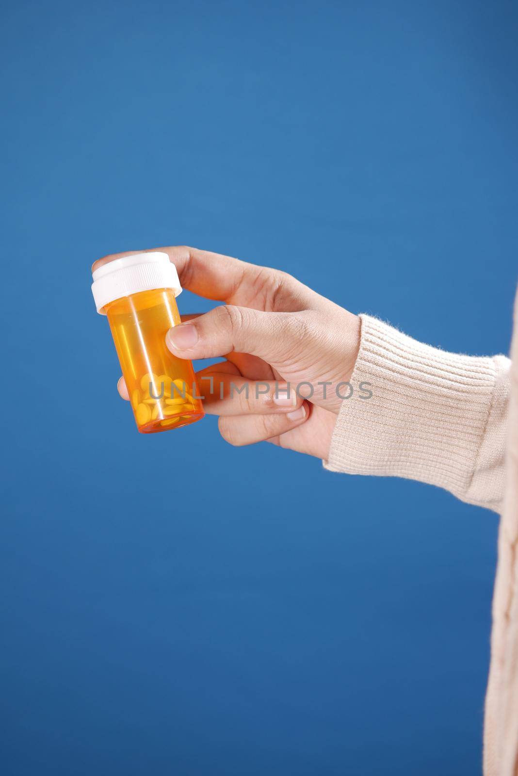 women man hand holding medicine pill container .