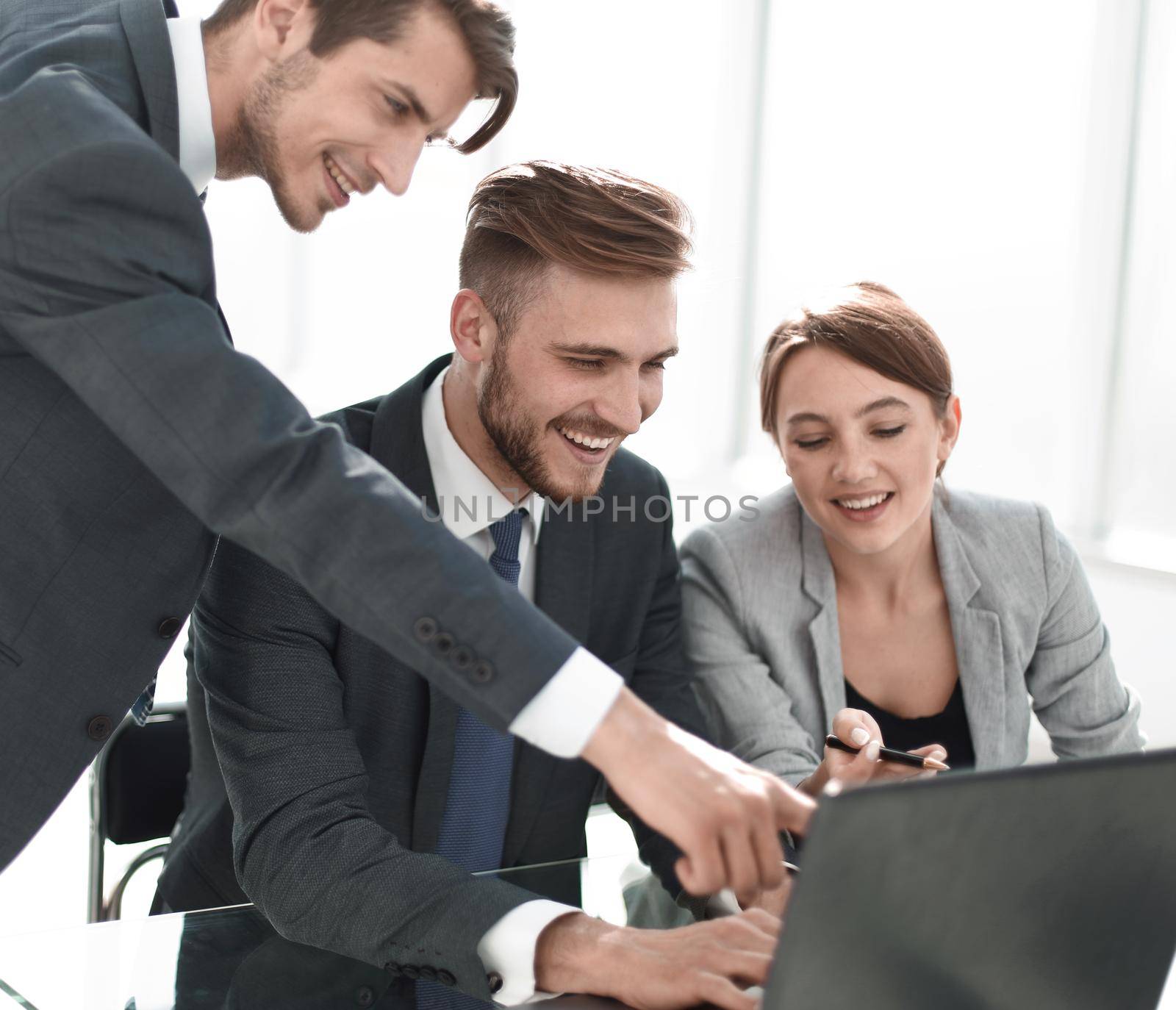 business team is working on a laptop in the office.people and technology