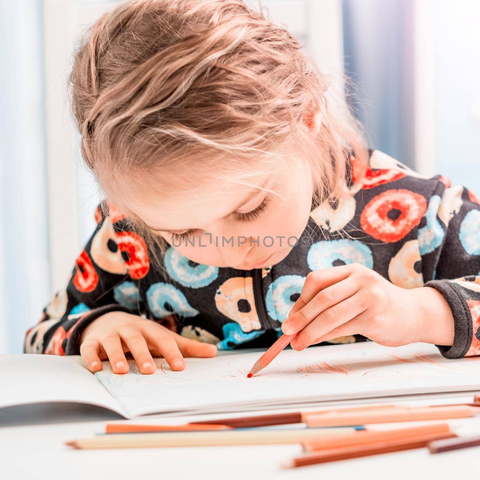 Little blonde girl draws with pencils by GekaSkr