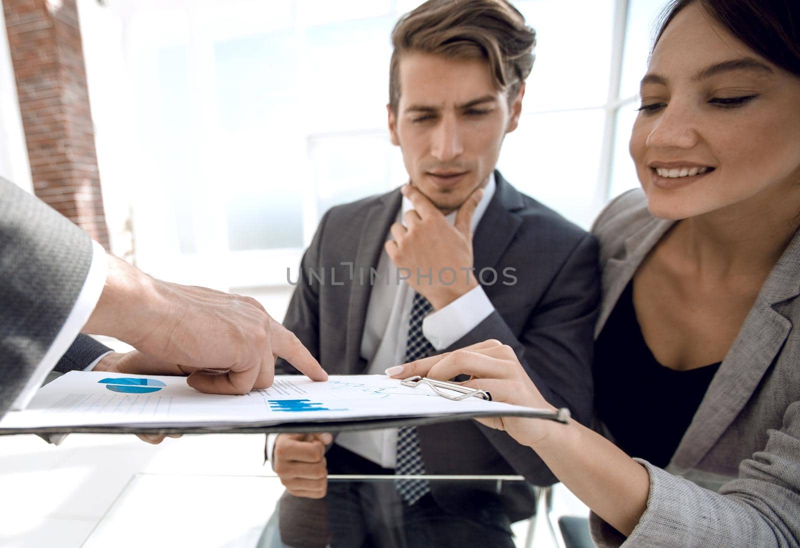 close up.employees of the company making a financial report.photo with copy space