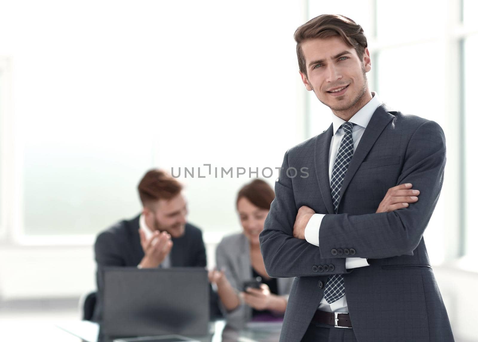 young businessman standing in the office.photo with copy space