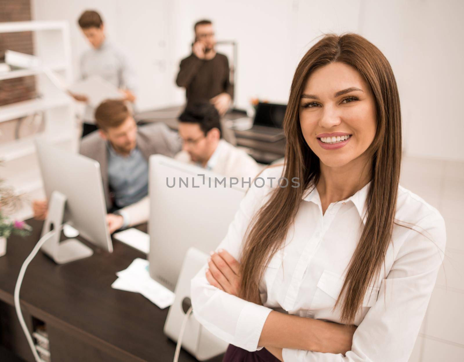 smiling businesswoman standing in a modern office.business people