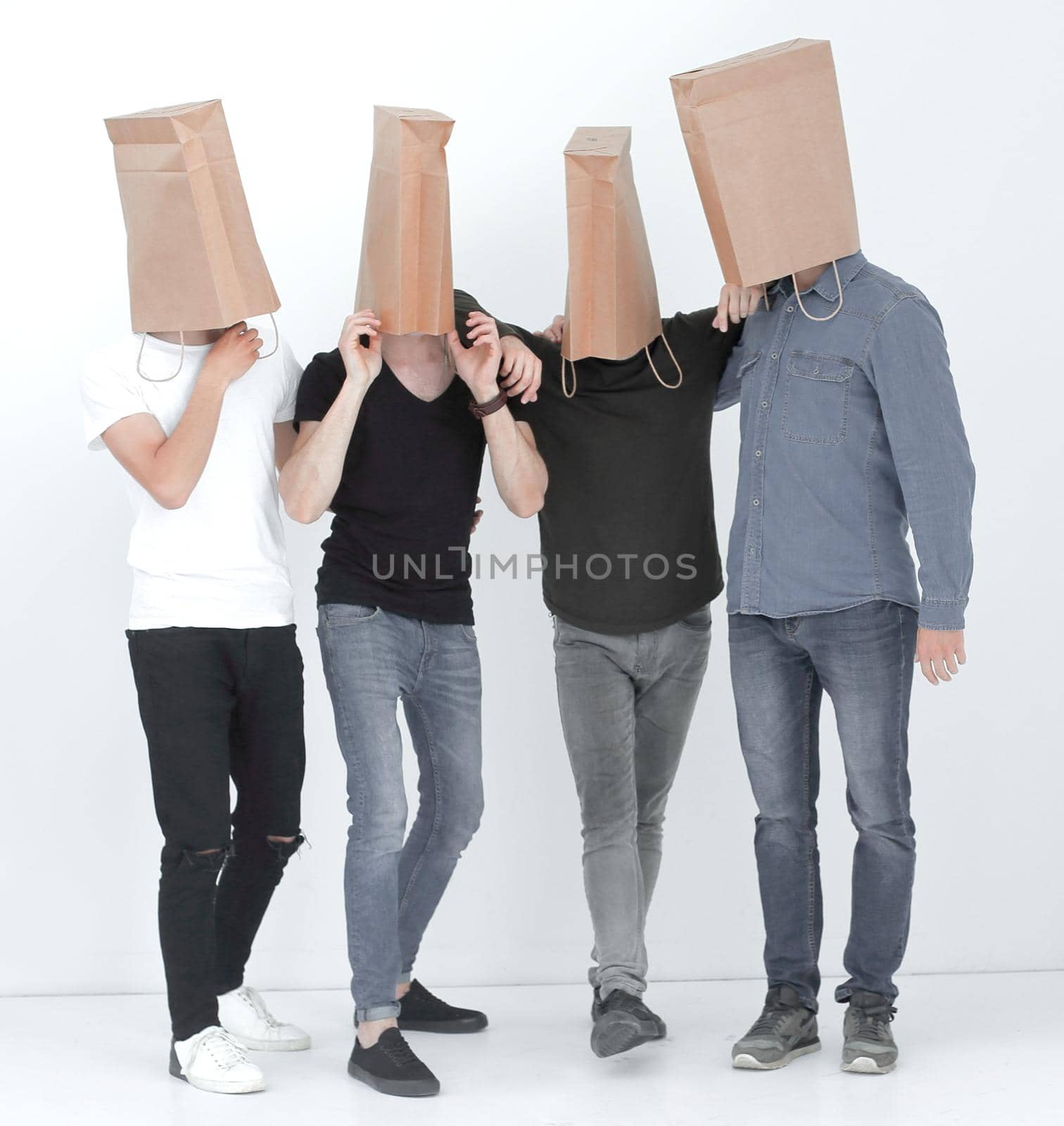 group of young people with paper bags on their heads by asdf