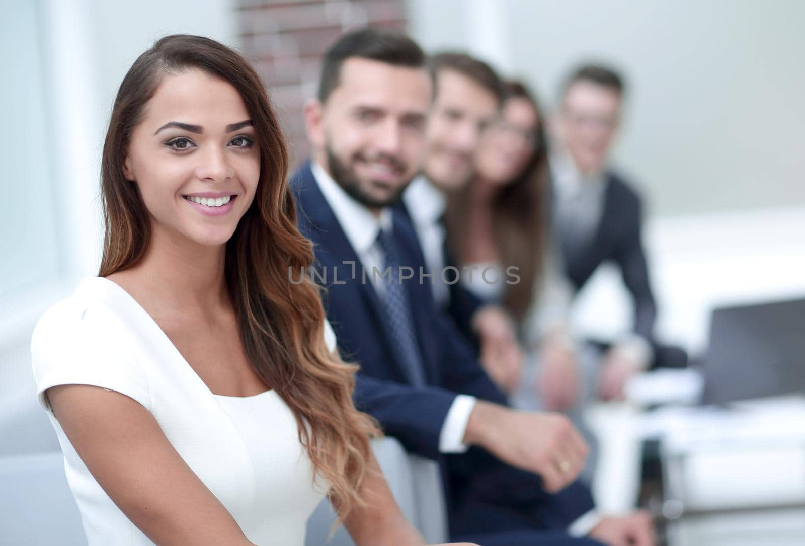 young business woman on the background of the office. business concept