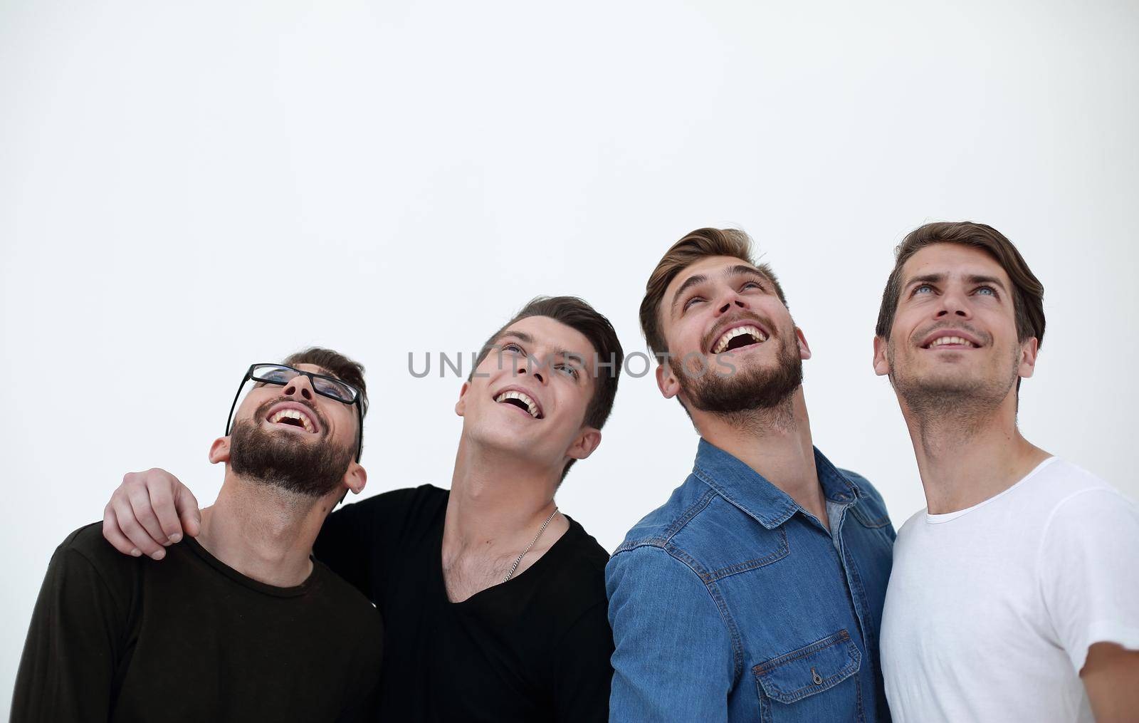 Happy positive group of men looking up with dreamy expression