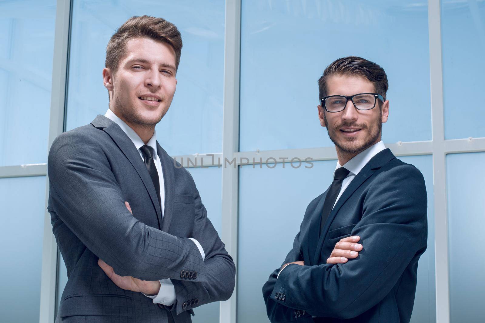 two young business men isolated on office
