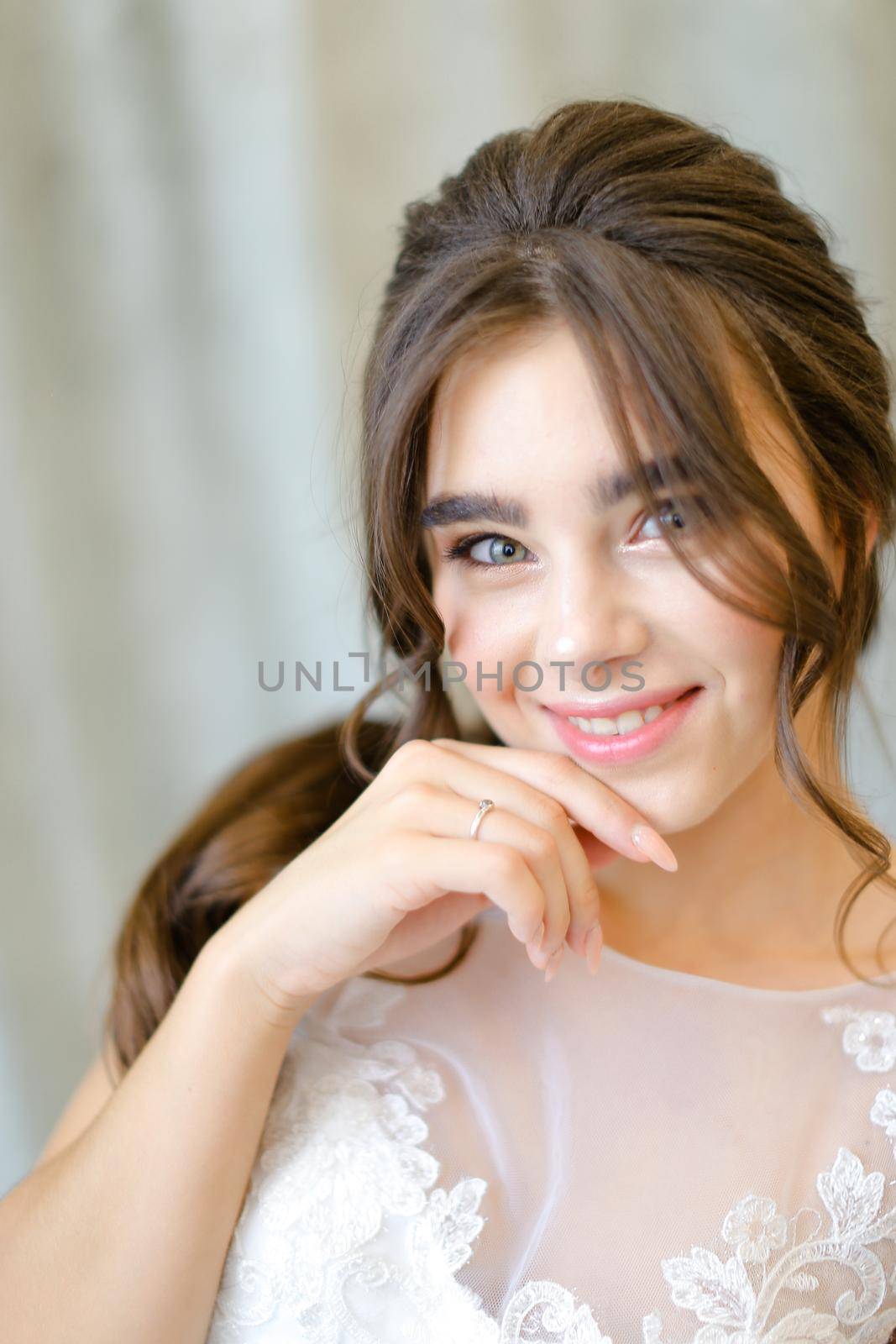 Close up portrait of young brunette caucasian bride at studio. Concept of bridal photo session and beauty.