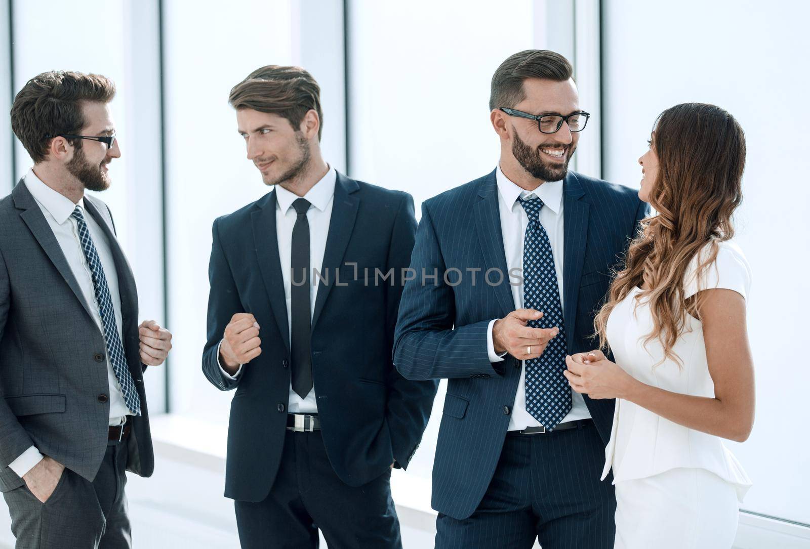 boss and employees standing in the office corridor.the concept of punctuality and discipline