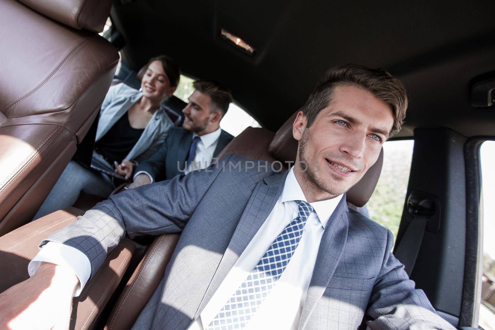 business team working in the back seat of the car.people and technology