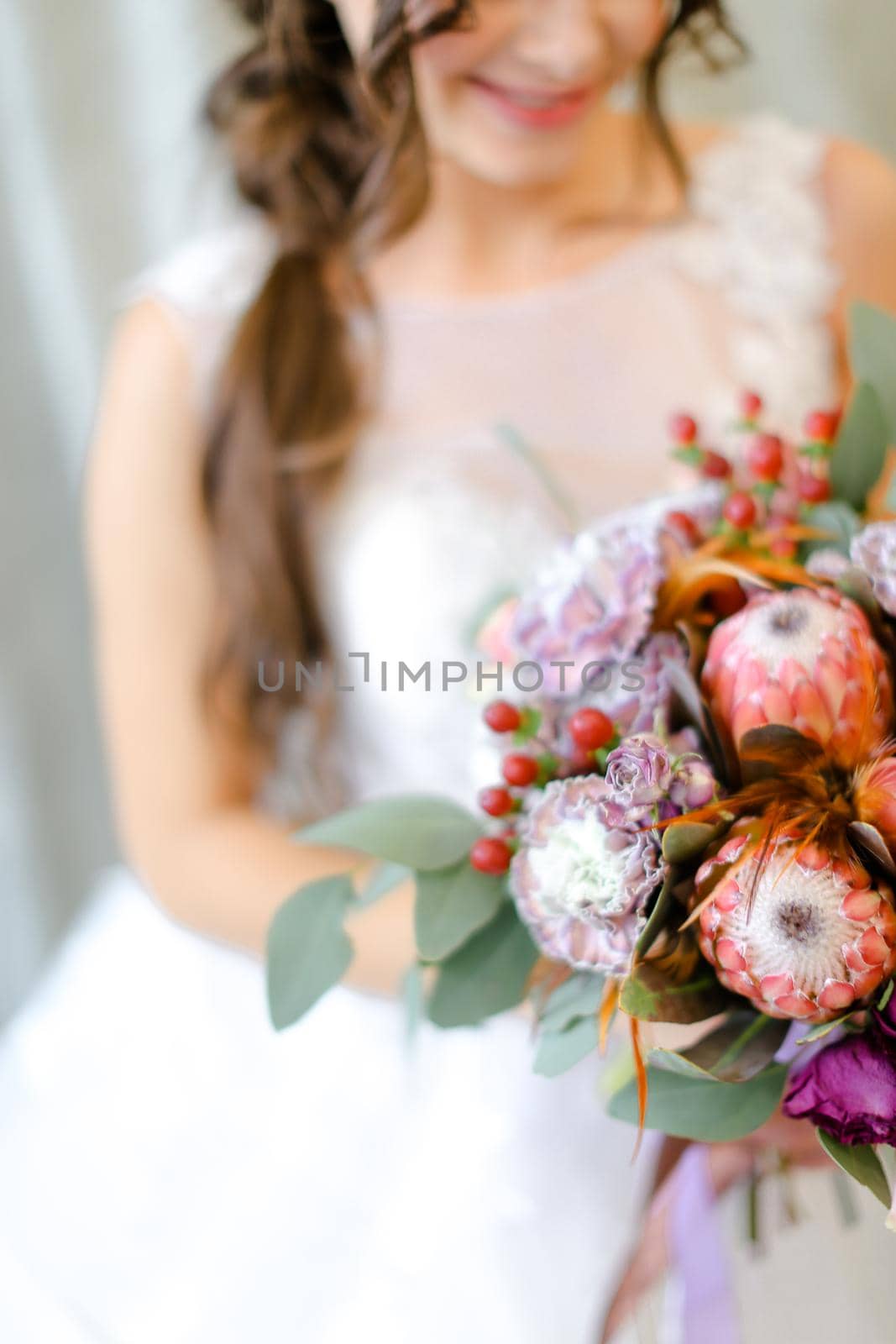 Close up bouquet of flowers in bride hands. Concept of floristic art and bridal photo session.