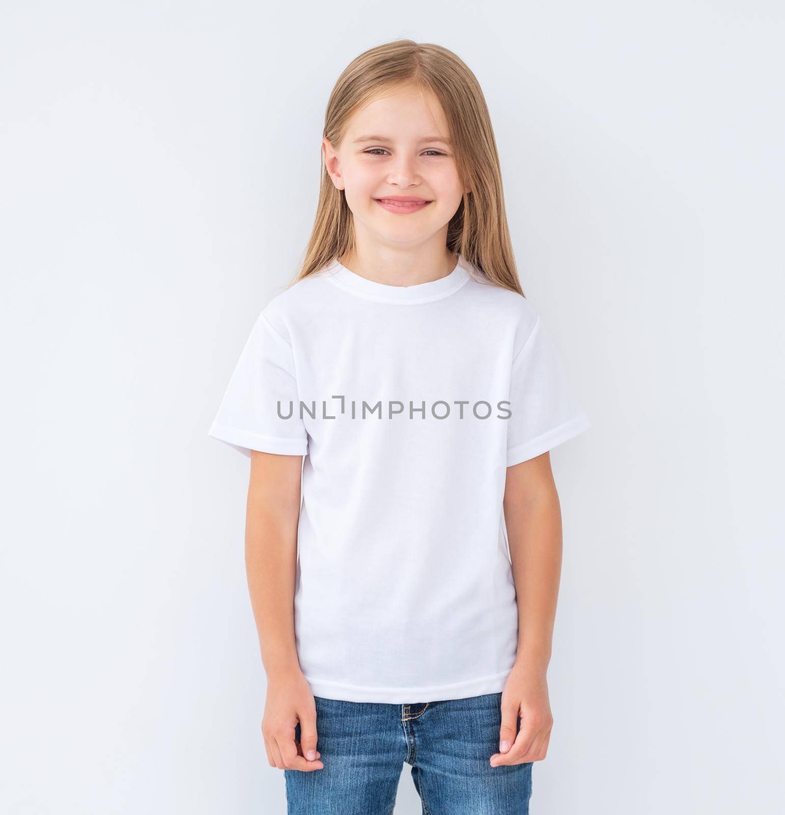 Little girl in white blank t-shirt, isolated by GekaSkr