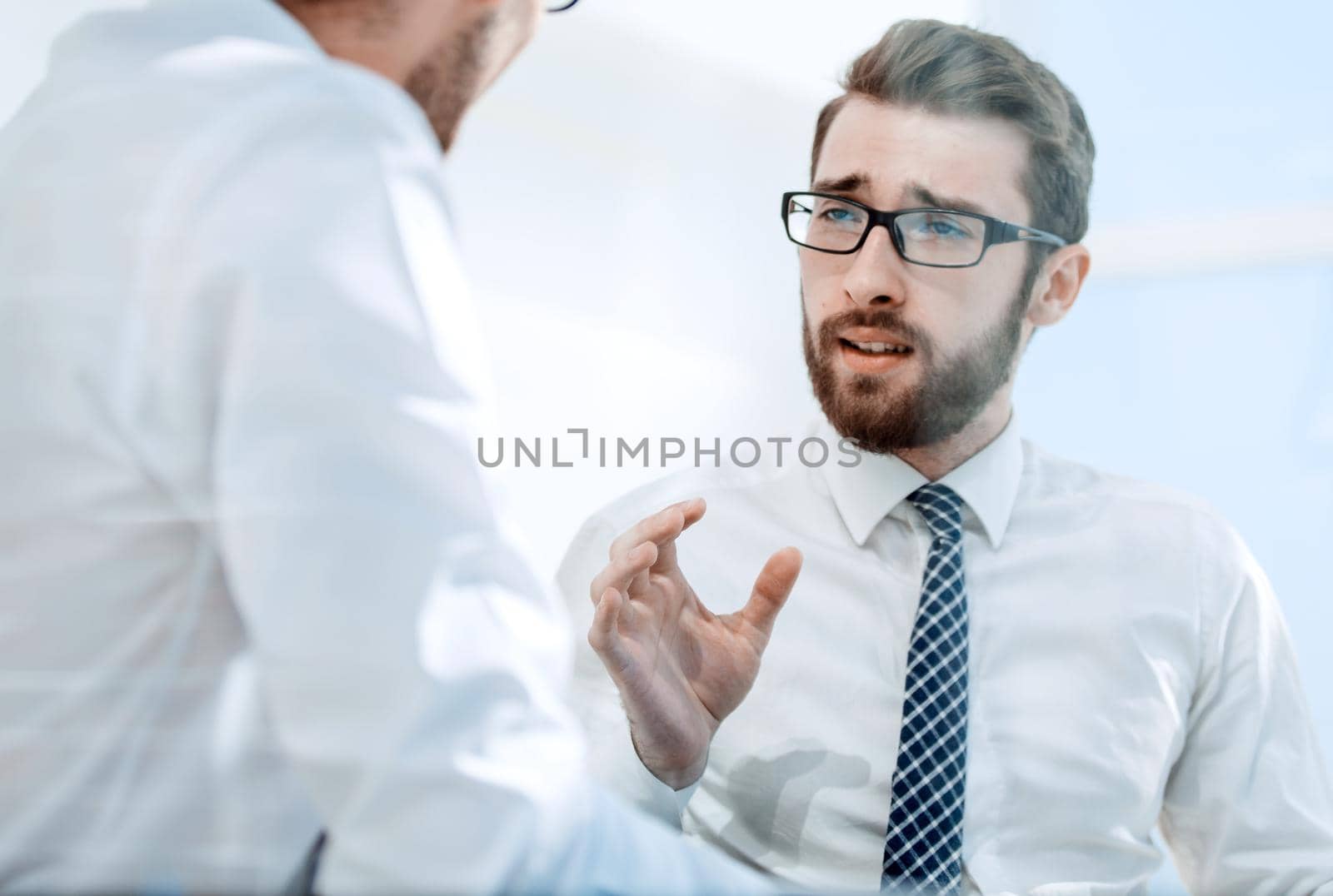 close up.two employees discussing a new business plan.photo with copy space