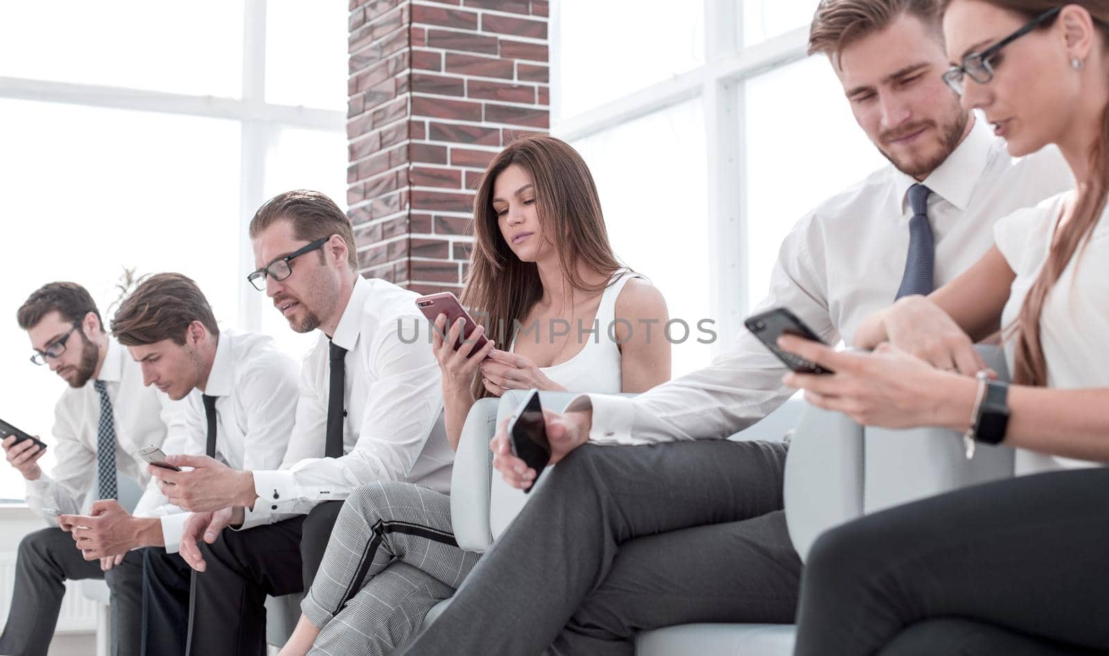 employees with gadgets, waiting for the beginning of a business meeting . people and technology
