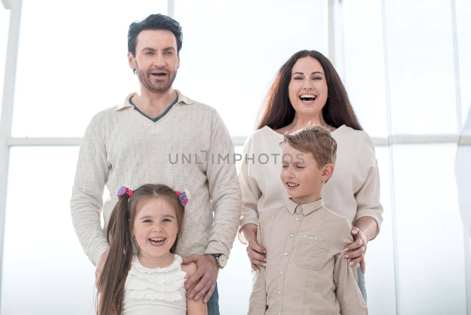 portrait of a happy family with small children. the concept of parenthood