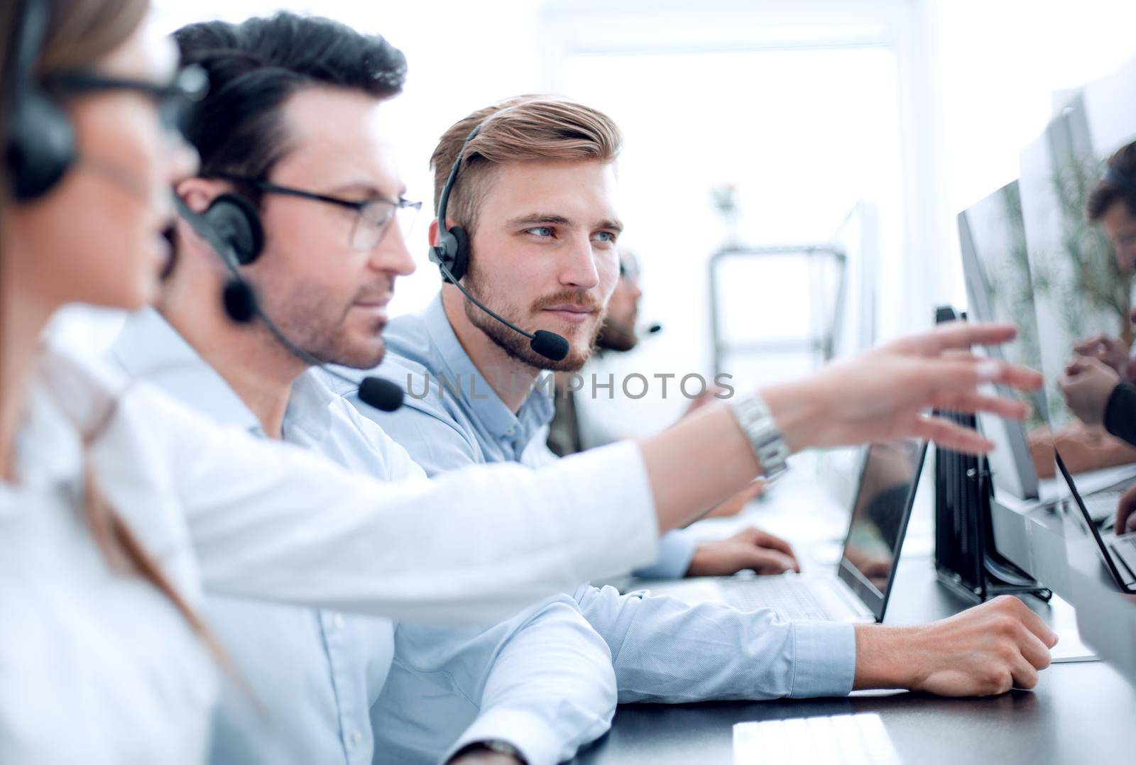 close up.call center staff discuss the information received