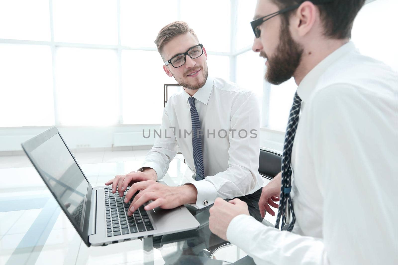 smiling employees at the Desk in the office.photo with copy space